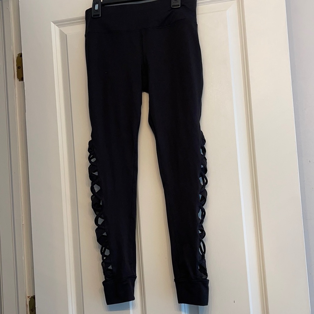 Betsy Johnson leggings with crisscross sides.